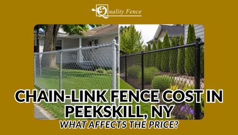 Black chain-link fence with gate installed around a residential backyard in Peekskill NY